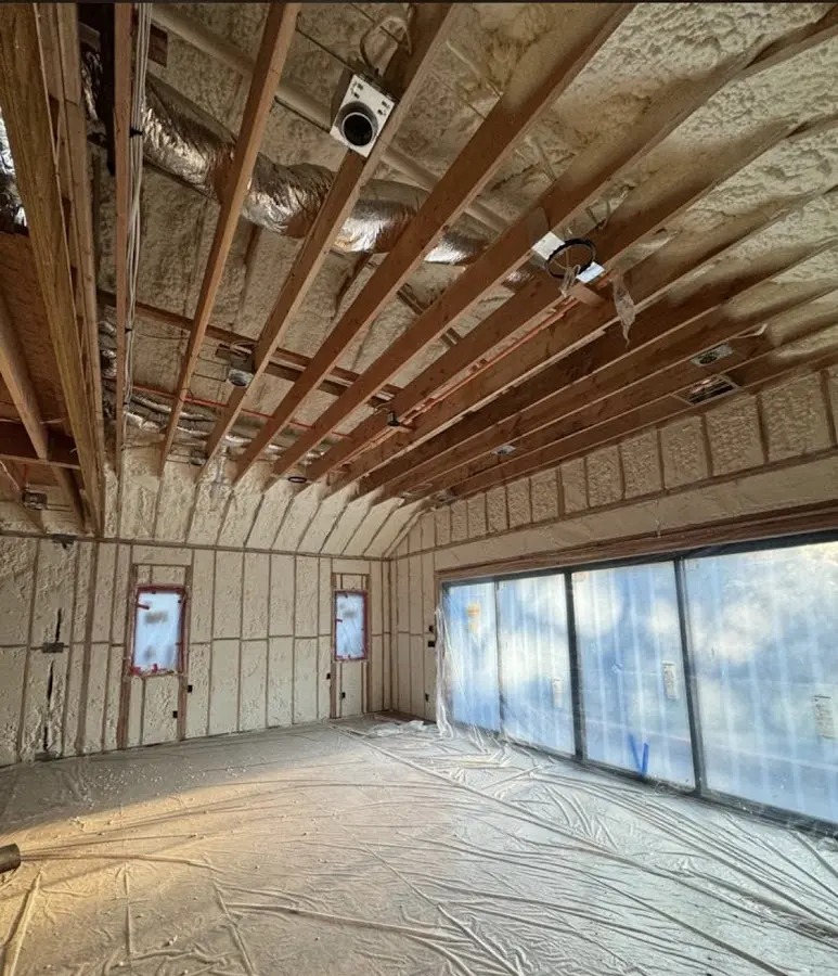 Interior walls and ceiling insulated with spray foam during new construction in Farr West
